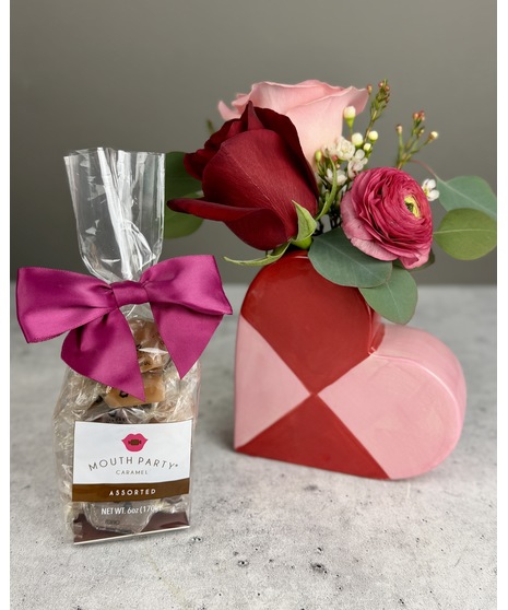 Small floral arrangement in a heart-shaped vase designed for desks or small spaces.