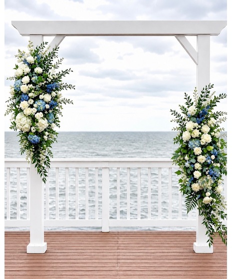 Wedding centerpiece with peach roses, delphinium, Queen Anne’s lace, and eucalyptus. Available in petite or full size.