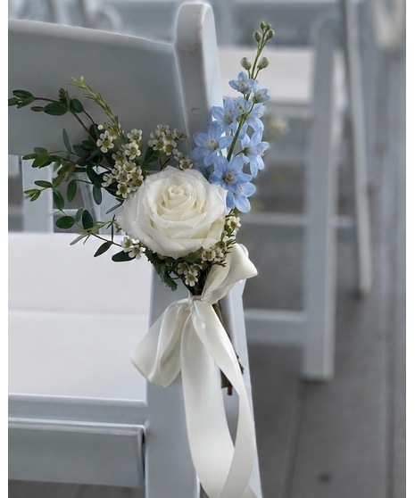 Wedding centerpiece with peach roses, delphinium, Queen Anne’s lace, and eucalyptus. Available in petite or full size.