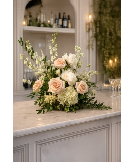 Romantic blush and ivory wedding accent arrangements with soft seasonal blooms in a delicate garden-inspired style.