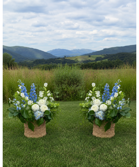Wedding centerpiece with peach roses, delphinium, Queen Anne’s lace, and eucalyptus. Available in petite or full size.