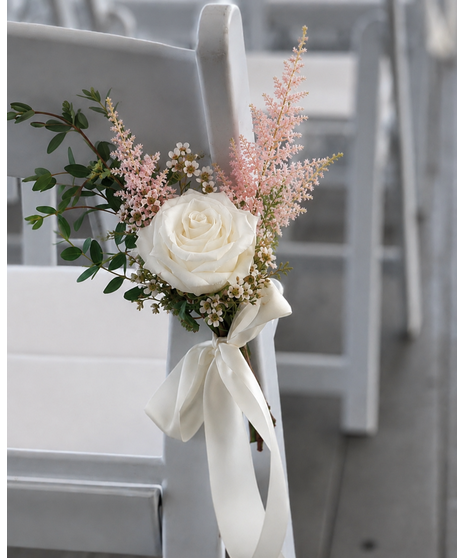 Romantic peach, blush, and cream ceremony flowers designed for weddings and altar styling.