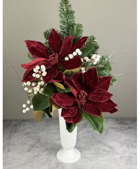 Silk holiday cemetery arrangement in a cone; available in burgundy poinsettia or gold magnolia styles with winter greenery.