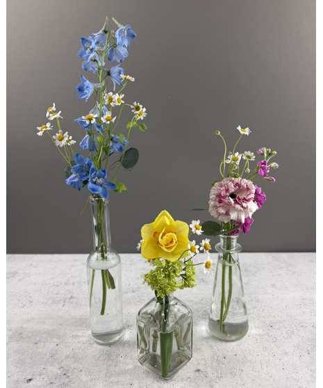 Seasonal wildflower arrangement with colorful, natural blooms in a rustic, meadow-inspired style.