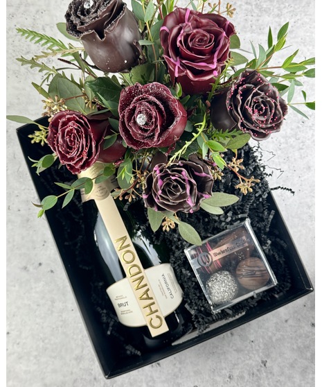 Chocolate-toned wax-dipped roses arranged with truffles and wine. Non-edible. Choice of Chandon Brut or Moët & Chandon.
