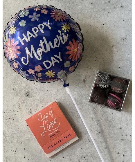 Tiered gift set with treats, spa items, balloon, and optional wine or champagne.