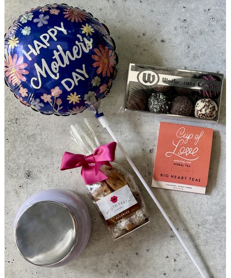 Tiered gift set with treats, spa items, balloon, and optional wine or champagne.
