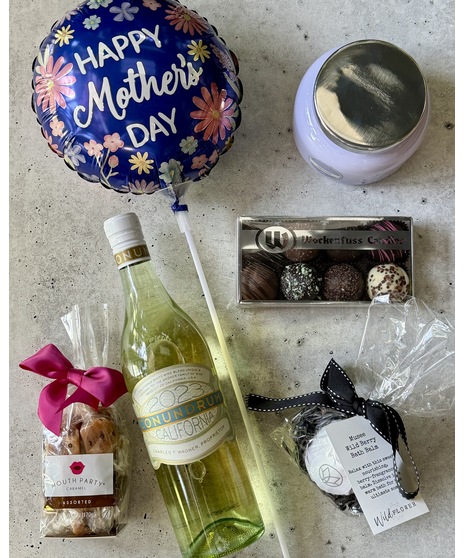 Tiered gift set with treats, spa items, balloon, and optional wine or champagne.