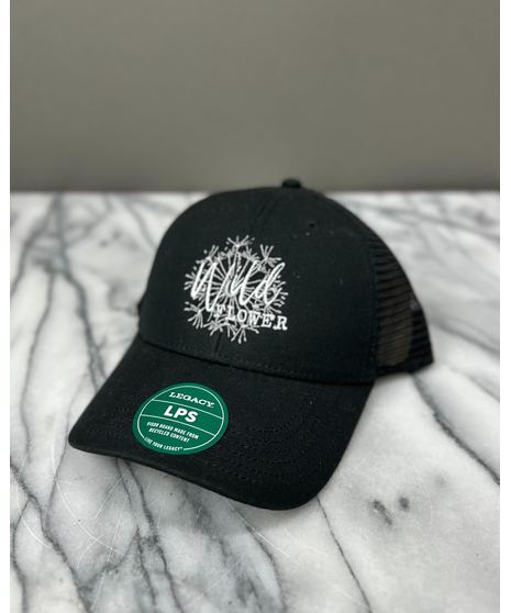 WildFlower custom trucker hats featuring an embroidered logo. Available in Black or Gray and Camel with adjustable mesh backs.