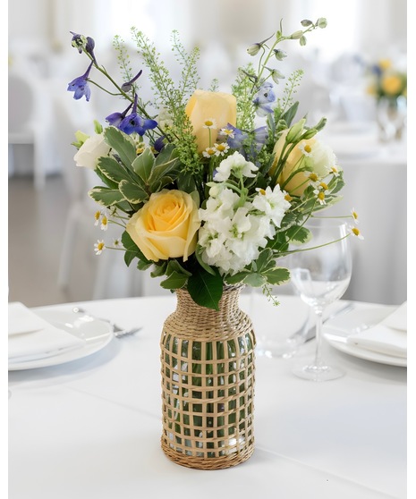 Wedding accent arrangements featuring white, blue, and yellow blooms for cocktail tables, displays, bars, and reception décor.