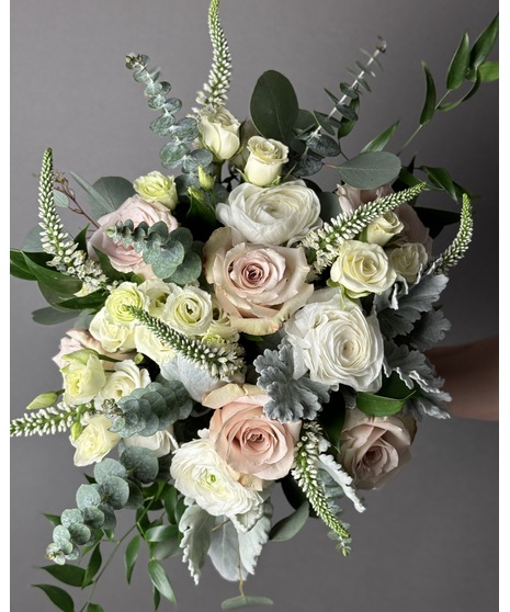 Romantic blush and ivory bridal bouquet with soft garden roses, white blooms, and airy greenery.