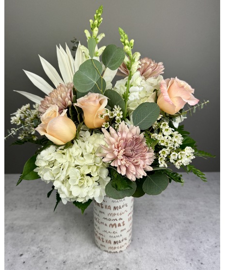 pink and sunshine yellow flower arrangments
