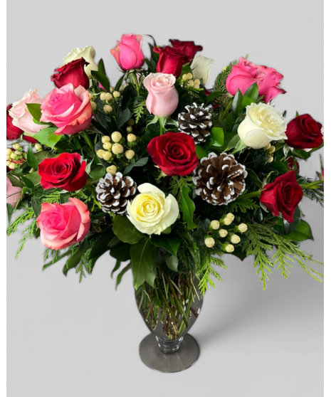 n arrangement of fresh roses in holiday colors with greenery, pinecones, and white berries. Available in sizes from 1 rose to 100.