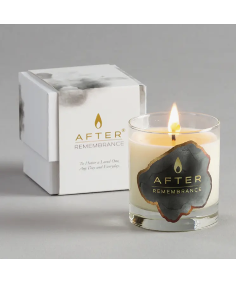 A beautiful Peace Lily with white blooms and an After Remembrance Candle presented in an elegant wooden box, perfect for offering peace and comfort.