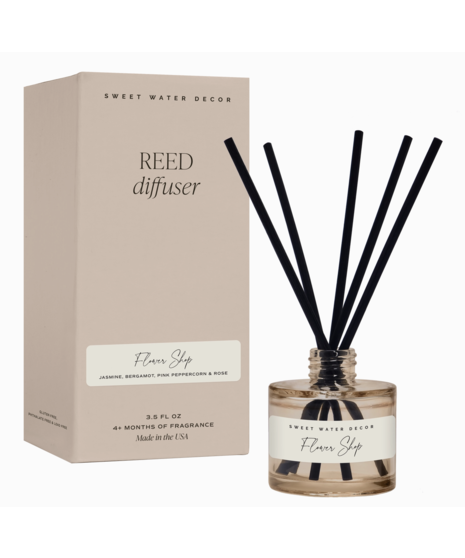 Glass reed diffuser with black reeds. Available in Salt & Sea, Flower Shop, or Wildflower & Salt scents. Lasts over 4 months.