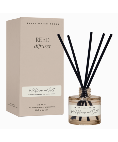Glass reed diffuser with black reeds. Available in Salt & Sea, Flower Shop, or Wildflower & Salt scents. Lasts over 4 months.