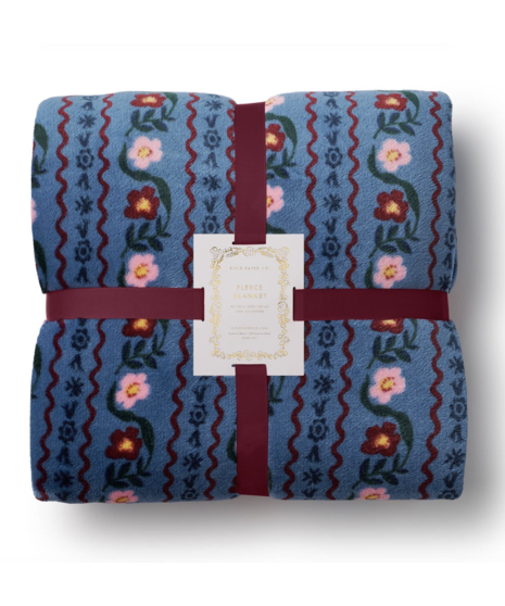 Soft fleece throw blanket featuring colorful patterned designs by Rifle Paper Co.