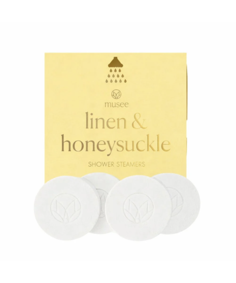 Round shower steamer tablets used to release fragrance and create a spa-like shower experience.