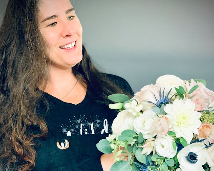 One of our floral designers shows off her handiwork